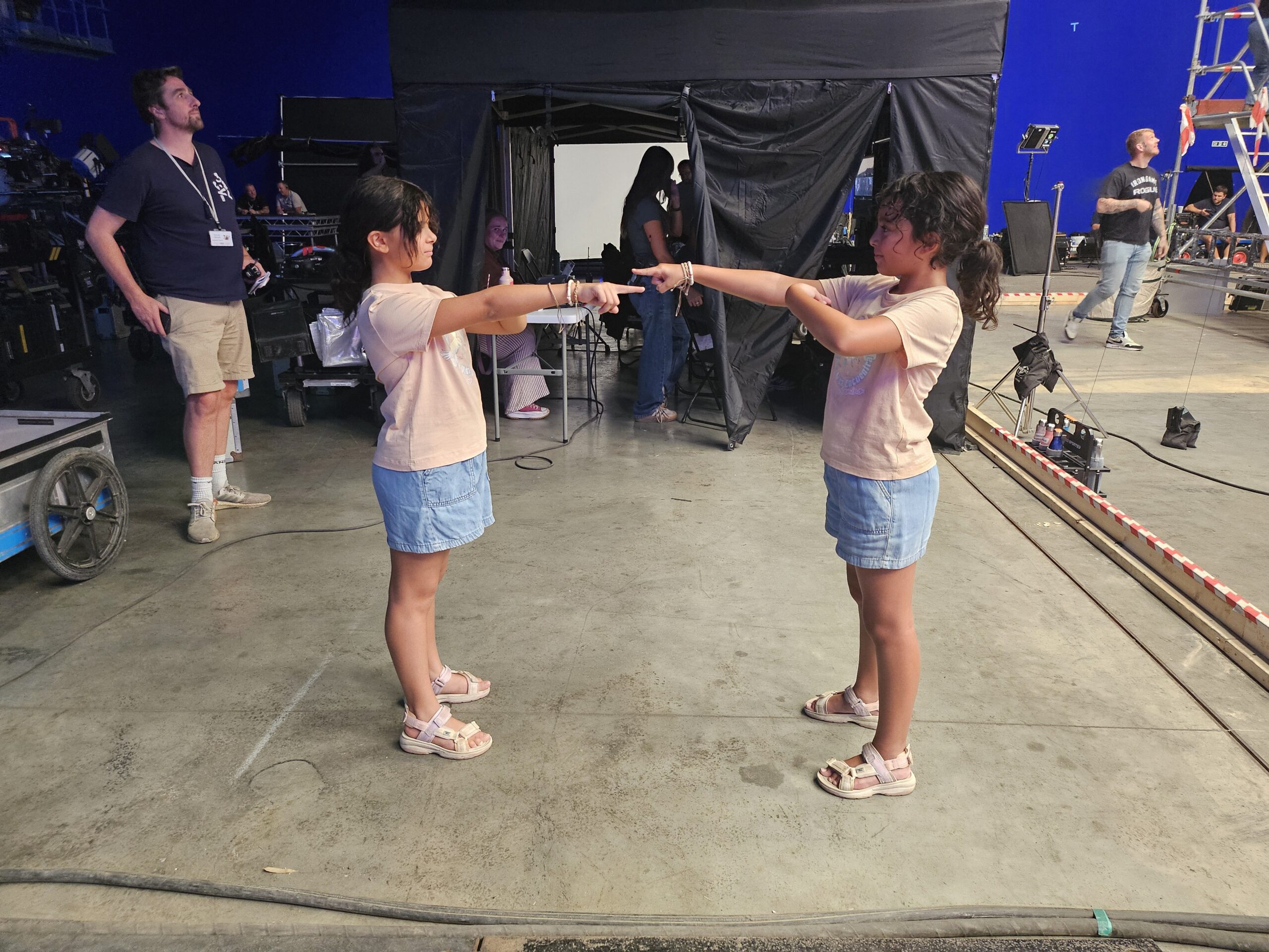 Audrina Miranda and body double Amber Joshi pointing at each other on the set of 'Jurassic World: Rebirth'