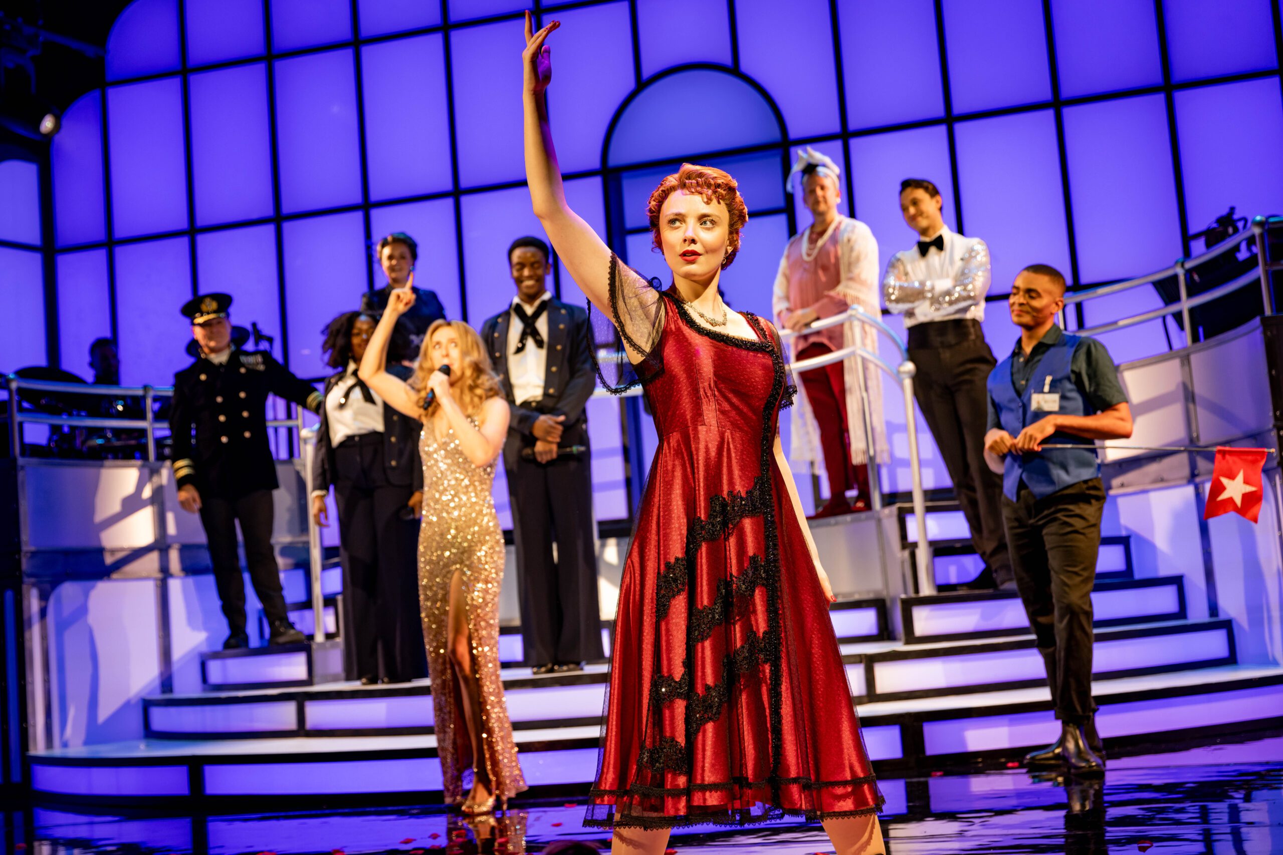 Singers on stage performing in 'Titanique' the musical