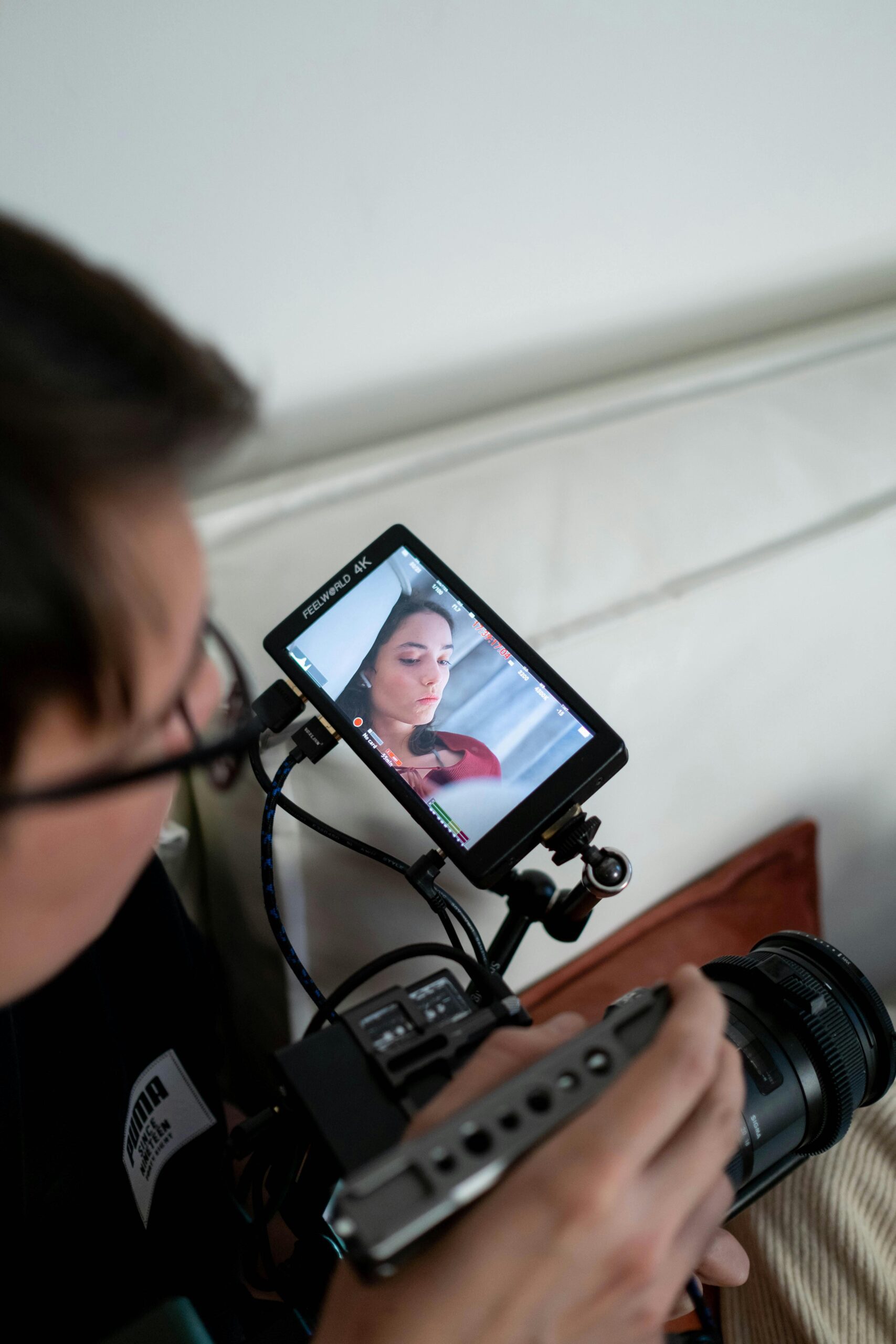 Cameraman filming woman